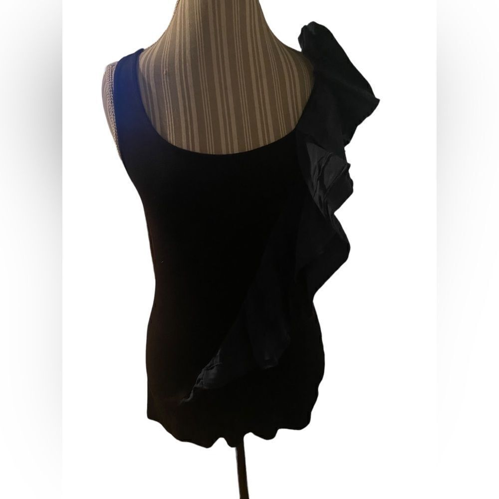 Free People awesome size medium black tank with dark blue ruffle accent awesome